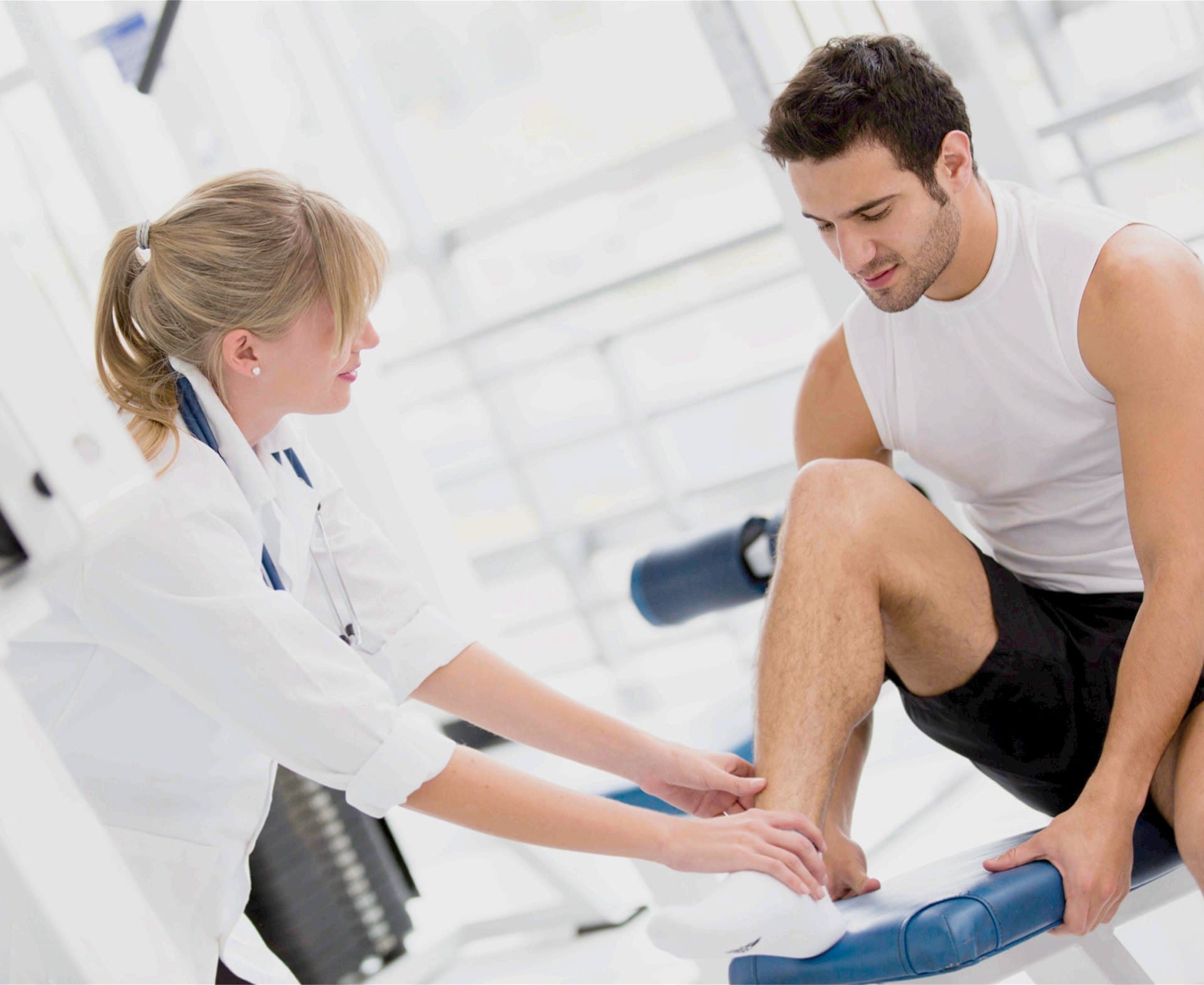 A clinician examining an athlete
